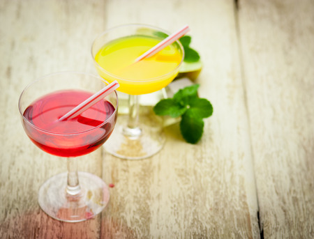 Various alcoholic cocktails on woodの写真素材