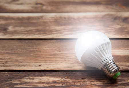 LED bulb and Incandescent bulbs on the wooden,Light Effect