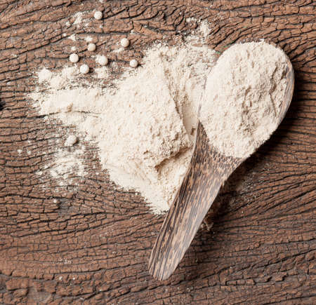 White pepper grain and powder isolated on white backgroundの写真素材