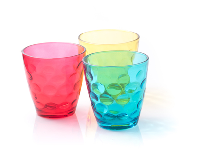 Color drink glasses isolated on whiteの写真素材