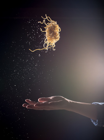 Hand throwing egg noodles on dark background,Flying egg noodlesの写真素材