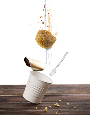 Flying instant cup noodle on white background ,instant cup noodle floatingの写真素材
