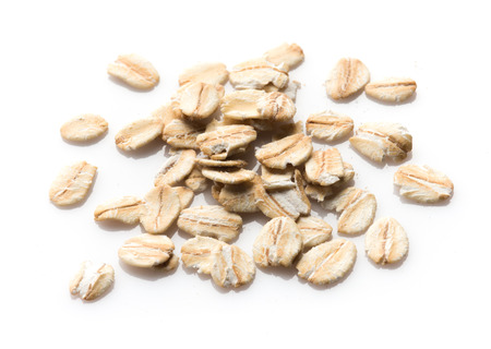 Oat flakes on white background