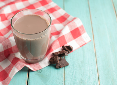 Glass of chocolate milk on vintage wood backgroundの写真素材