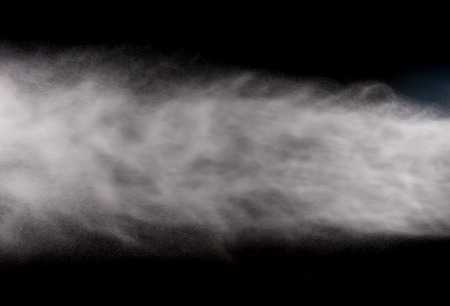 water spray of high pressure water jet on black backgroundの写真素材