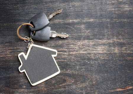 Symbol of the house with key on woodenの写真素材