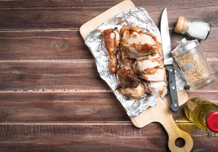 grilled chicken pieces on wooden boardの写真素材