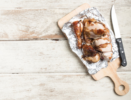 grilled chicken pieces on wooden boardの写真素材