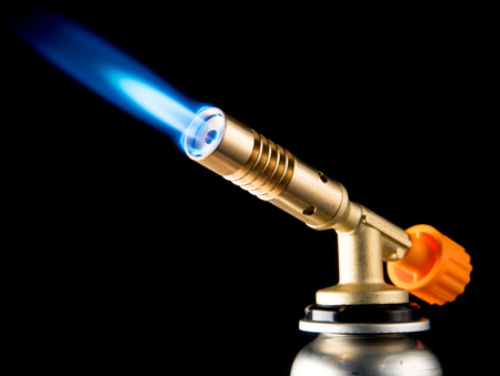 manual gas burner with blue flameの写真素材
