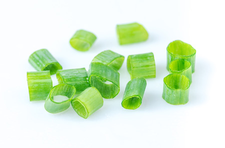 chopped spring onion or scallion isolated on white background