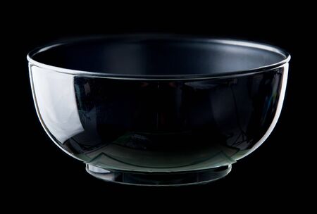 Empty black bowl on dark backgroundの写真素材