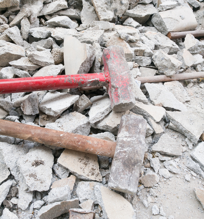 Hammer with broken bricks and concreteの写真素材