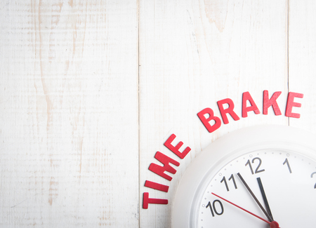 Wall clock and wording  TIME BREAK  on wooden with with Text Space