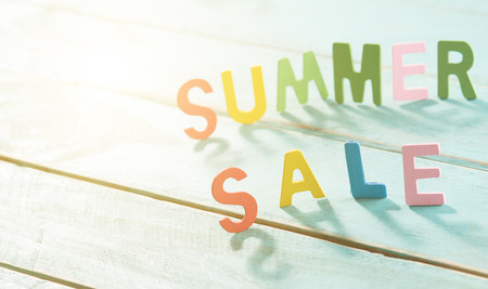 SUMMER SALE word made from colored letters wooden on wood letters