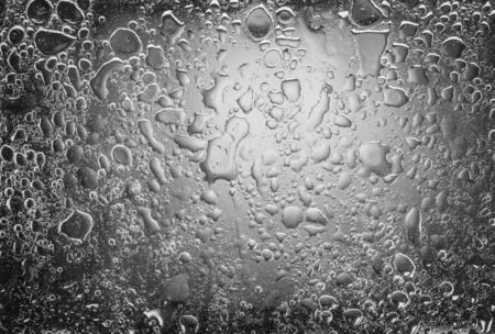 oil drops and water drops on glass,abstract background