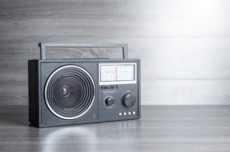 Vintage radio on wood table with copy spaceの写真素材
