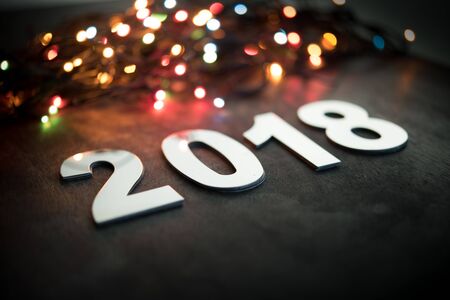 New year 2018,Metal words of 2018 with blurred color lights bokeh,Selective focus with shallow depth...