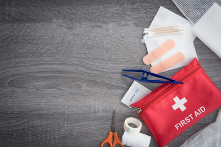 First aid medical kit on wood background,copy space,top viewのeditorial素材
