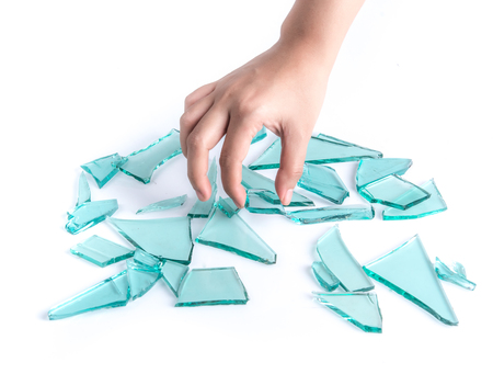 Hand Holding a Broken glass isolated on white backgroundの写真素材