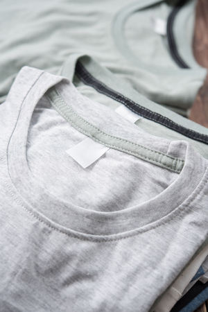 Set blank t-shirt on wooden tableの写真素材