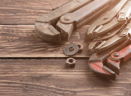Pipe wrench,adjustable wrench on wooden backgroundの写真素材