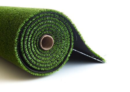 artificial rolled green grass isolated on white backgroundの写真素材