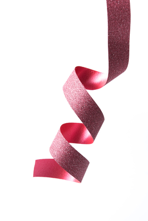 Red ribbon on a white background.の写真素材