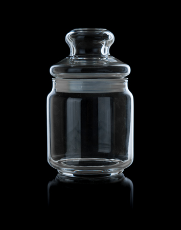 Empty glass jar on a black backgroundの写真素材