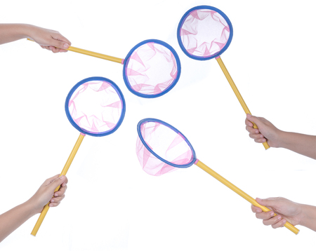 Hand holding Pink spoon fishing net isolated on whiteの写真素材
