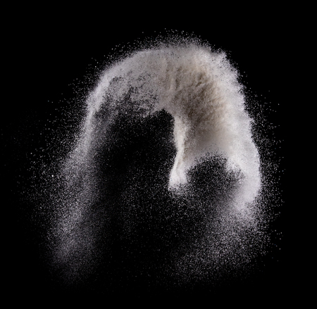 Washing powder explosion isolated on over dark background,Motion blurの写真素材