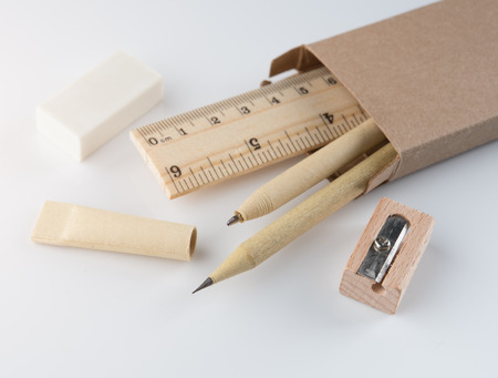 Stationery set,Set of wooden writing tools, pencil, pen, ruler, eraser and sharpener on white backgroundの写真素材