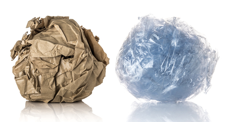 Brown Crumpled paper ball and Crumpled plastic ball isolated on whiteの写真素材