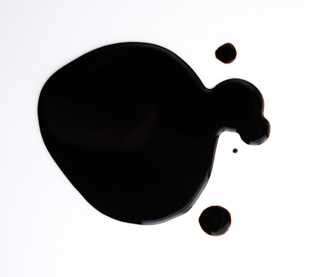 Spilled soy sauce isolated on whiteの写真素材