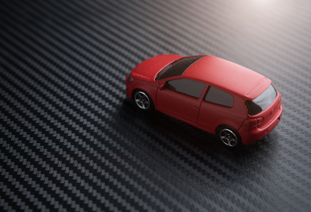 Red miniature car on black backgroundの写真素材