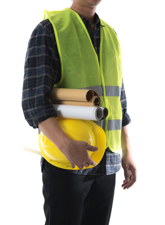 Construction concept,Asian engineer man holding yellow helmet and blue print paper isolated on whiteの写真素材