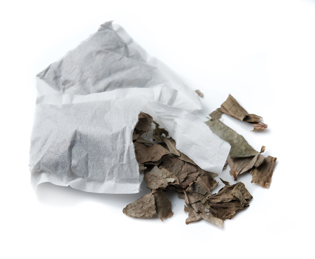 Herbal tea out of the tea bag on a white backgroundの写真素材