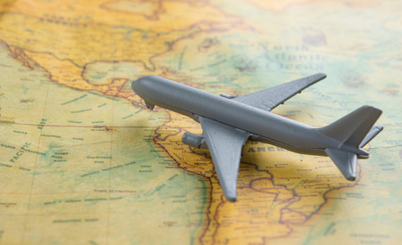 Travel and Transportation concept,Gray Miniature toy airplane on the mapの写真素材