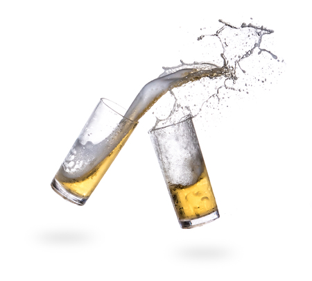 Beer splashing from glass isolated on white backgroundの写真素材