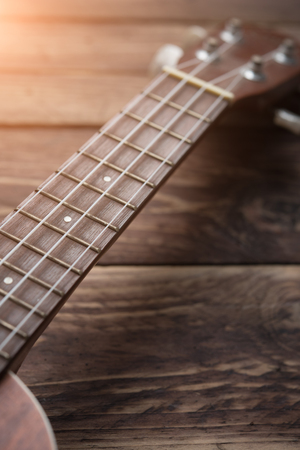 Ukulele guitar on table woodの写真素材
