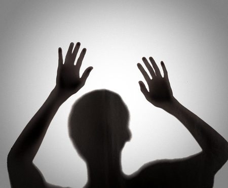 Silhouette of someone holding butcher knife,blur image