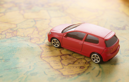Travel and Transportation concept,Red miniature car on the mapの写真素材