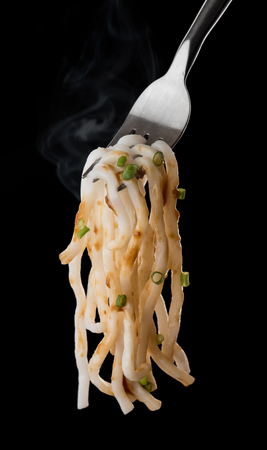 Japanese udon noodles on a forkの写真素材