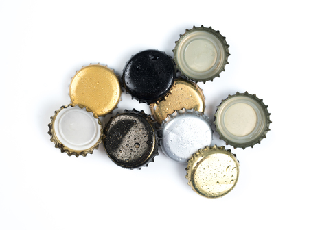 Beer bottle caps on white backgroundの写真素材