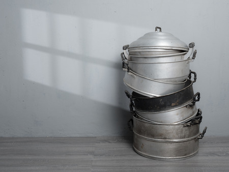 Old stainless steel steamer pot against gray wall background,original style Thai cookingの写真素材