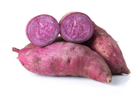 Fresh purple cassava isolated on whiteの写真素材