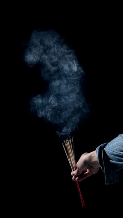 Incense smoke on a black backgroundの写真素材
