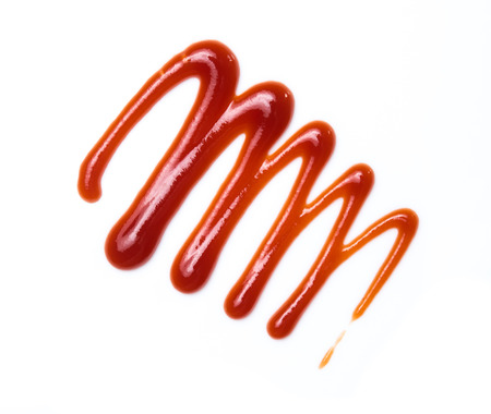 Red ketchup tomato sauce isolated on whiteの写真素材