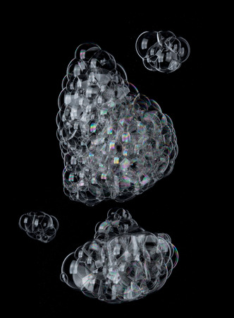 Soap foam Shaving cream bubble isolated on blackの写真素材