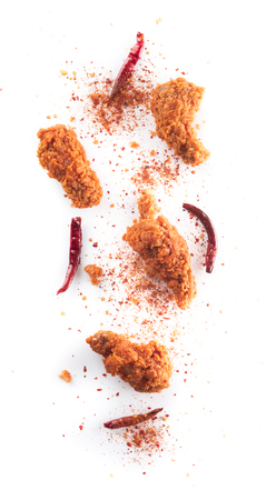 Spicy fried chicken wings on whiteの写真素材