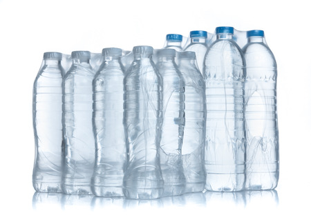 Plastic bottles water in wrapped package on whiteの写真素材